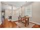 Cozy office space with hardwood floors, a large window, and a view of the adjacent dining area at 6277 Raven Rock Dr, Denver, NC 28037