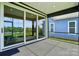 Covered patio features a sliding glass door and ample space for outdoor relaxation and entertainment at 6277 Raven Rock Dr, Denver, NC 28037