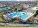 Aerial view of a luxurious pool area surrounded by lounge chairs, perfect for relaxation and recreation at 6277 Raven Rock Dr, Denver, NC 28037