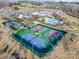 Aerial view showcasing tennis and pickleball courts, and the community clubhouse with a swimming pool at 6277 Raven Rock Dr, Denver, NC 28037