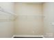 Empty walk-in closet with white wire shelving and hardwood floors at 6277 Raven Rock Dr, Denver, NC 28037
