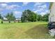 Expansive backyard featuring a well-maintained lawn and mature trees at 635 Scarlet Leaf Ln, Oakboro, NC 28129