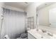 Clean bathroom featuring a shower/tub combo, gray shower curtain, and a vanity sink at 635 Scarlet Leaf Ln, Oakboro, NC 28129