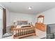 Bedroom with wooden bed frame, matching dresser, and two side tables with lamps at 635 Scarlet Leaf Ln, Oakboro, NC 28129