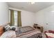 Comfortable bedroom with a neutral color scheme, window, and ample natural light at 635 Scarlet Leaf Ln, Oakboro, NC 28129