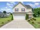 Charming two-story home with a well-maintained lawn, a two-car garage, and nicely manicured landscaping at 635 Scarlet Leaf Ln, Oakboro, NC 28129