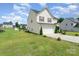 Charming house with a two-car garage, well-kept lawn, and neat landscaping, set in a Gathering-friendly neighborhood at 635 Scarlet Leaf Ln, Oakboro, NC 28129
