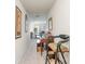 Hallway featuring neutral carpeting, artwork, and glimpses of the living area, creating a welcoming entrance at 635 Scarlet Leaf Ln, Oakboro, NC 28129