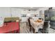 Bright kitchen with white cabinets, granite countertops, stainless steel refrigerator and an adjacent dining area at 635 Scarlet Leaf Ln, Oakboro, NC 28129