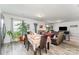Open-concept living room seamlessly blends the dining area with the seating area and modern gray floors at 635 Scarlet Leaf Ln, Oakboro, NC 28129