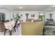 View of a living room and dining area combination featuring neutral walls, ample seating, and natural light at 635 Scarlet Leaf Ln, Oakboro, NC 28129