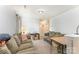 Spacious living room with comfortable sofas, a table lamp, neutral walls, and carpeted flooring at 635 Scarlet Leaf Ln, Oakboro, NC 28129