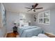 This bedroom features natural light, neutral colors, ceiling fan, and hardwood floors at 660 Ideal Way, Charlotte, NC 28203