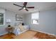 Bedroom with natural light, ceiling fan, and hardwood floors at 660 Ideal Way, Charlotte, NC 28203