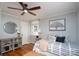 Bedroom with ceiling fan, a painting, and hardwood floors at 660 Ideal Way, Charlotte, NC 28203