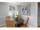 Bright dining area featuring a round table, wicker chairs, and soft lighting, perfect for intimate meals at 660 Ideal Way, Charlotte, NC 28203