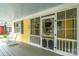 Cozy front porch showcases a decorative screen door, black shutters, and comfortable rocking chairs at 660 Ideal Way, Charlotte, NC 28203