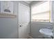 Cozy half bathroom with decorative art and pedestal sink at 660 Ideal Way, Charlotte, NC 28203