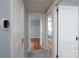 Hallway with hardwood and carpet flooring connecting to bedrooms at 660 Ideal Way, Charlotte, NC 28203