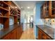 Hallway with dark cabinets and hardwood flooring at 660 Ideal Way, Charlotte, NC 28203