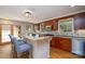 Beautiful kitchen with wood cabinets, granite countertops, stainless appliances, and breakfast bar seating at 660 Ideal Way, Charlotte, NC 28203