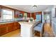 Bright kitchen with wood cabinets, granite countertops, stainless steel appliances, and breakfast bar seating at 660 Ideal Way, Charlotte, NC 28203