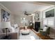 Inviting living room with a fireplace, hardwood flooring, comfortable seating, and plenty of natural light at 660 Ideal Way, Charlotte, NC 28203