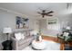 Stylish living room with hardwood floors, large windows, modern decor, and comfortable seating arrangement at 660 Ideal Way, Charlotte, NC 28203