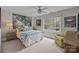 Bedroom with a view of lush greenery from a large window at 6916 Cameron Glen Dr, Charlotte, NC 28210