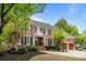 Elegant brick home with a manicured lawn and two-car garage at 6916 Cameron Glen Dr, Charlotte, NC 28210