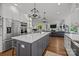 Open concept kitchen showcasing an expansive island, modern appliances, and seamless integration with the living space at 6916 Cameron Glen Dr, Charlotte, NC 28210