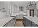 Bright and modern kitchen featuring white cabinets, stainless steel appliances, and a spacious center island at 6916 Cameron Glen Dr, Charlotte, NC 28210