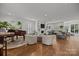 The house offers an open-concept floor plan and a spacious living room with hardwood floors and lots of natural light at 6916 Cameron Glen Dr, Charlotte, NC 28210