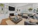 This spacious living room showcases a cozy fireplace and built-in shelves surrounding a large screen tv at 6916 Cameron Glen Dr, Charlotte, NC 28210