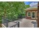 Spacious back deck showcasing railings and views of the landscaped yard at 7117 Cobblecreek Dr, Weddington, NC 28104
