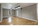 Spacious basement with neutral walls and decorative lighting perfect for recreation or storage at 7117 Cobblecreek Dr, Weddington, NC 28104