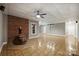 Finished basement featuring a brick fireplace, ample lighting, and neutral wall colors at 7117 Cobblecreek Dr, Weddington, NC 28104
