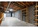 Unfinished basement showing concrete floor, block walls, and exposed ceiling with utilities at 7117 Cobblecreek Dr, Weddington, NC 28104