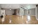 Expansive basement featuring hardwood floors, a vintage brick fireplace, and abundant natural light at 7117 Cobblecreek Dr, Weddington, NC 28104