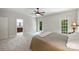 Spacious bedroom offering a tranquil ambiance, a ceiling fan, and a door leading to the outdoors at 7117 Cobblecreek Dr, Weddington, NC 28104