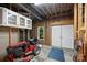 Basement garage or workshop featuring sliding doors and cabinets at 7117 Cobblecreek Dr, Weddington, NC 28104
