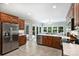 Open kitchen featuring stainless steel appliances, custom cabinetry, a spacious island, and a breakfast nook at 7117 Cobblecreek Dr, Weddington, NC 28104