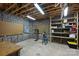 Basement workshop area with pegboard, shelving, and ample space for projects at 7117 Cobblecreek Dr, Weddington, NC 28104