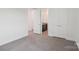 Spacious bedroom with carpet floors leading into the ensuite bathroom at 716 Flare Dr, Tega Cay, SC 29708