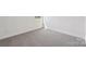 Bright bedroom with neutral carpet and natural light at 716 Flare Dr, Tega Cay, SC 29708