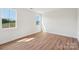 Bedroom with large windows and new vinyl hardwood flooring at 716 Flare Dr, Tega Cay, SC 29708