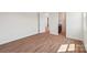 Bright bedroom with hardwood flooring and an attached bathroom at 716 Flare Dr, Tega Cay, SC 29708