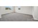 Bright room with neutral carpet and plenty of natural light at 716 Flare Dr, Tega Cay, SC 29708