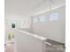 Bright hallway with multiple windows and a view of the outdoors at 716 Flare Dr, Tega Cay, SC 29708