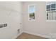Cozy laundry room featuring a wire shelf and natural light at 716 Flare Dr, Tega Cay, SC 29708